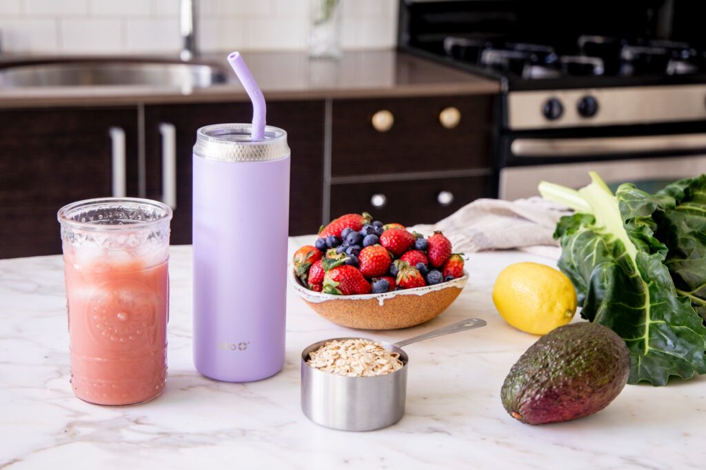 Fruit smoothie making ingredients and completed beverage